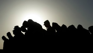 Soldiers-from-Task-Force-3-66-Bravo-Company-of-the-172-Infantry-Brigade-bow-their-heads-during-a-prayer-to-remember-the-victims-of-911-before-a-ceremony-at-Forward-Operating-Base-FOB-Kushamond-on-September-11-2011.-Johannes