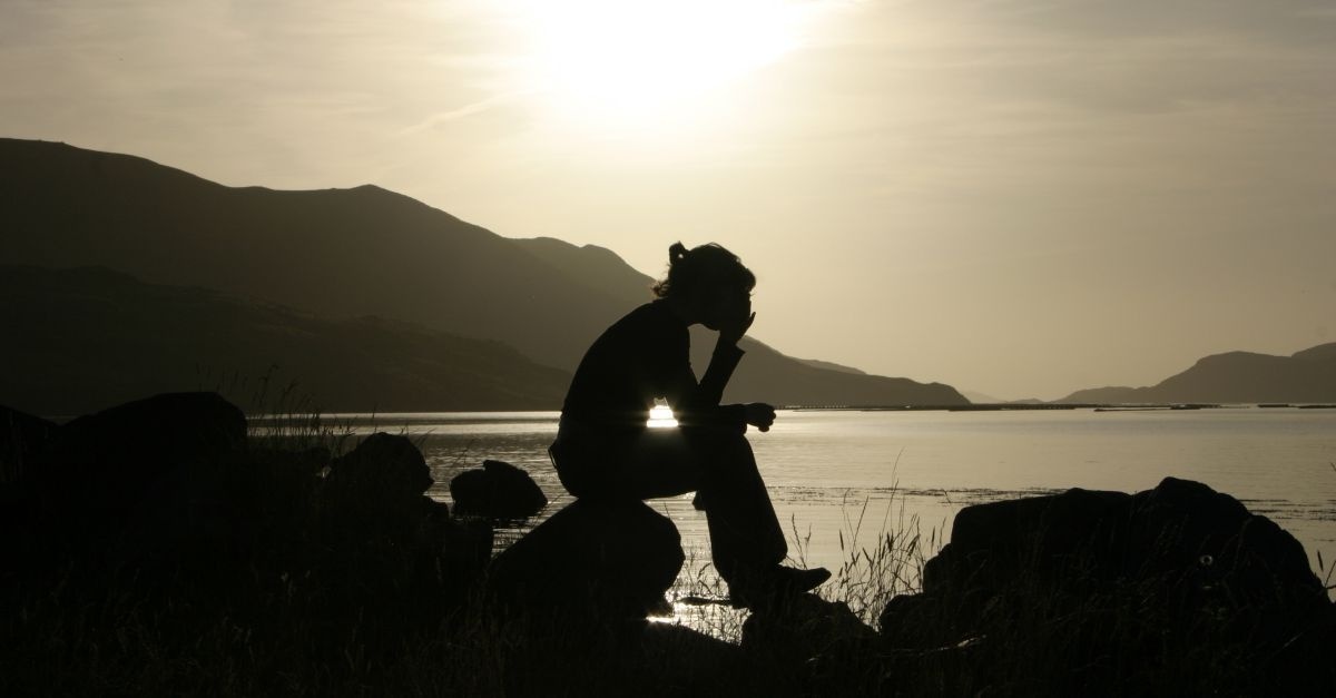 14458-woman-praying-lake-water-sun-light-silhouette-wide.1200w.tn